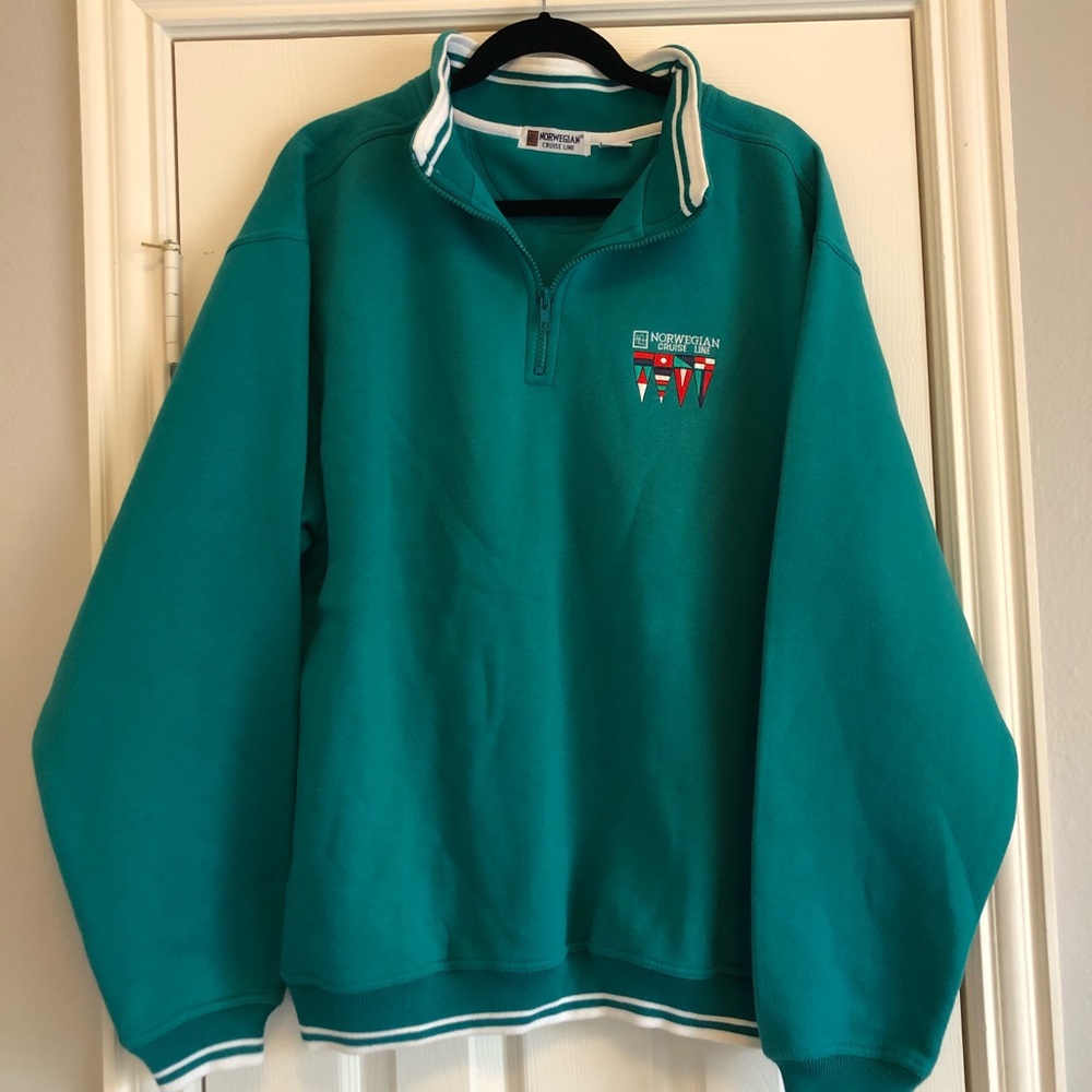 An oversized teal cruise sweatshirt